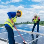 Professional solar cleaners work on a solar installation