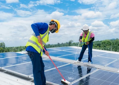 Professional solar cleaners work on a solar installation