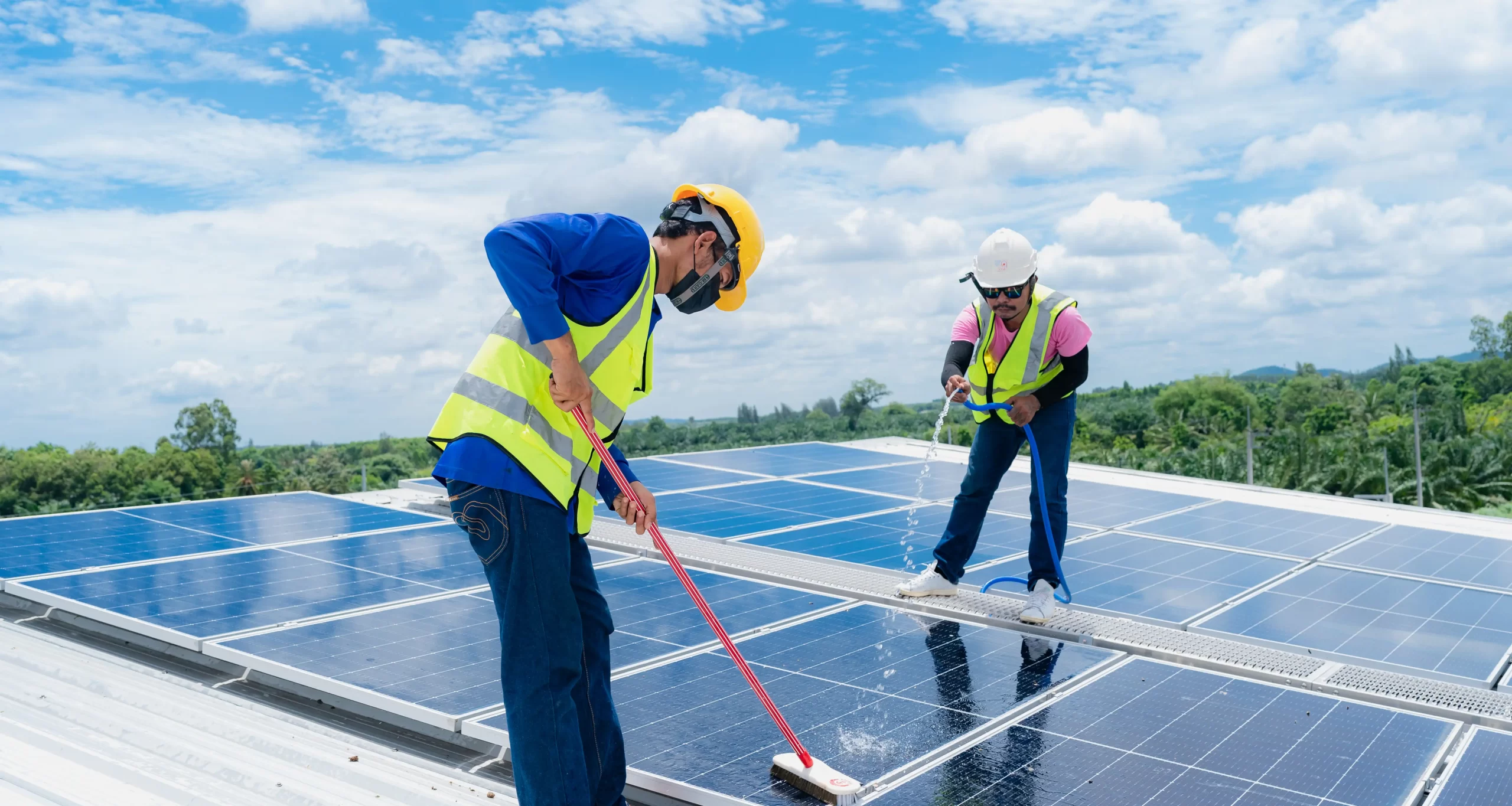 Professional solar cleaners work on a solar installation