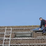 Solar panel installer on roof