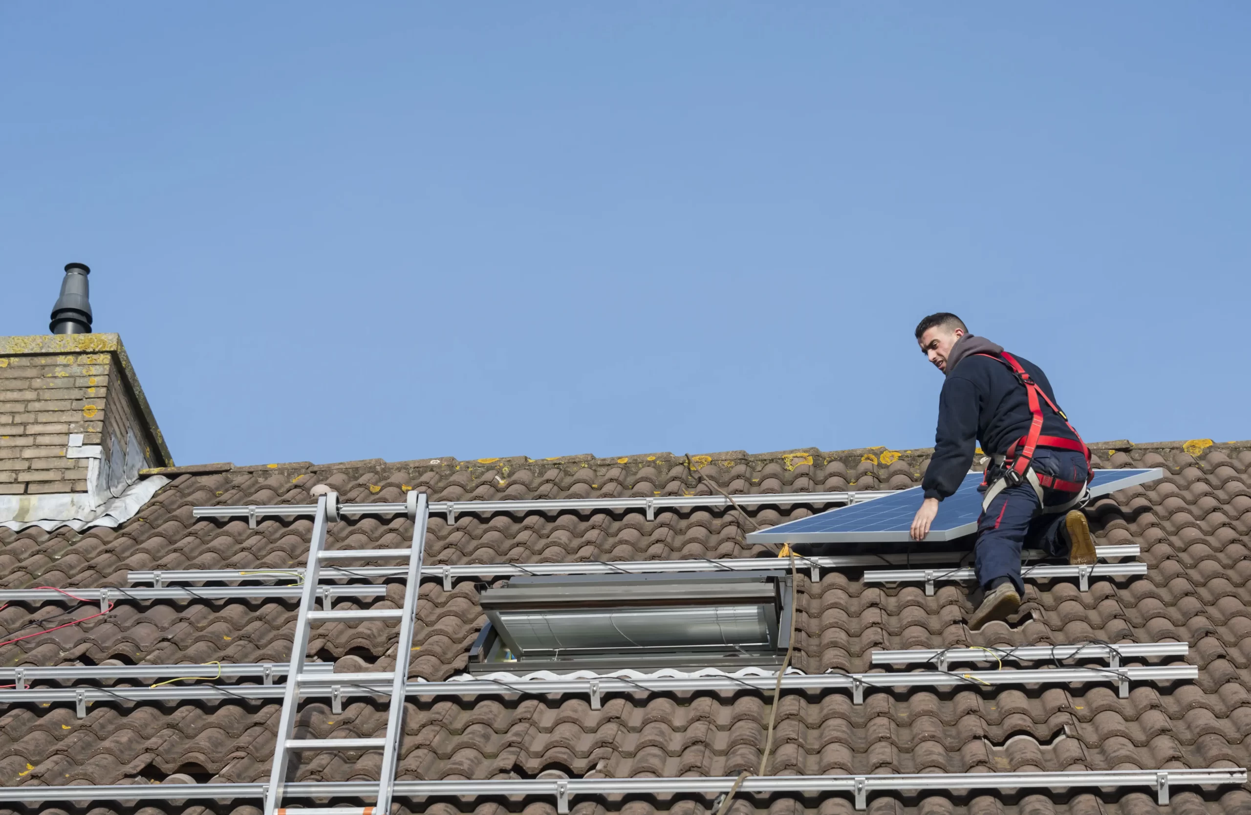 Solar panel installer on roof