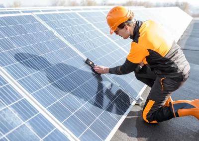 Technician inspecting solar panels